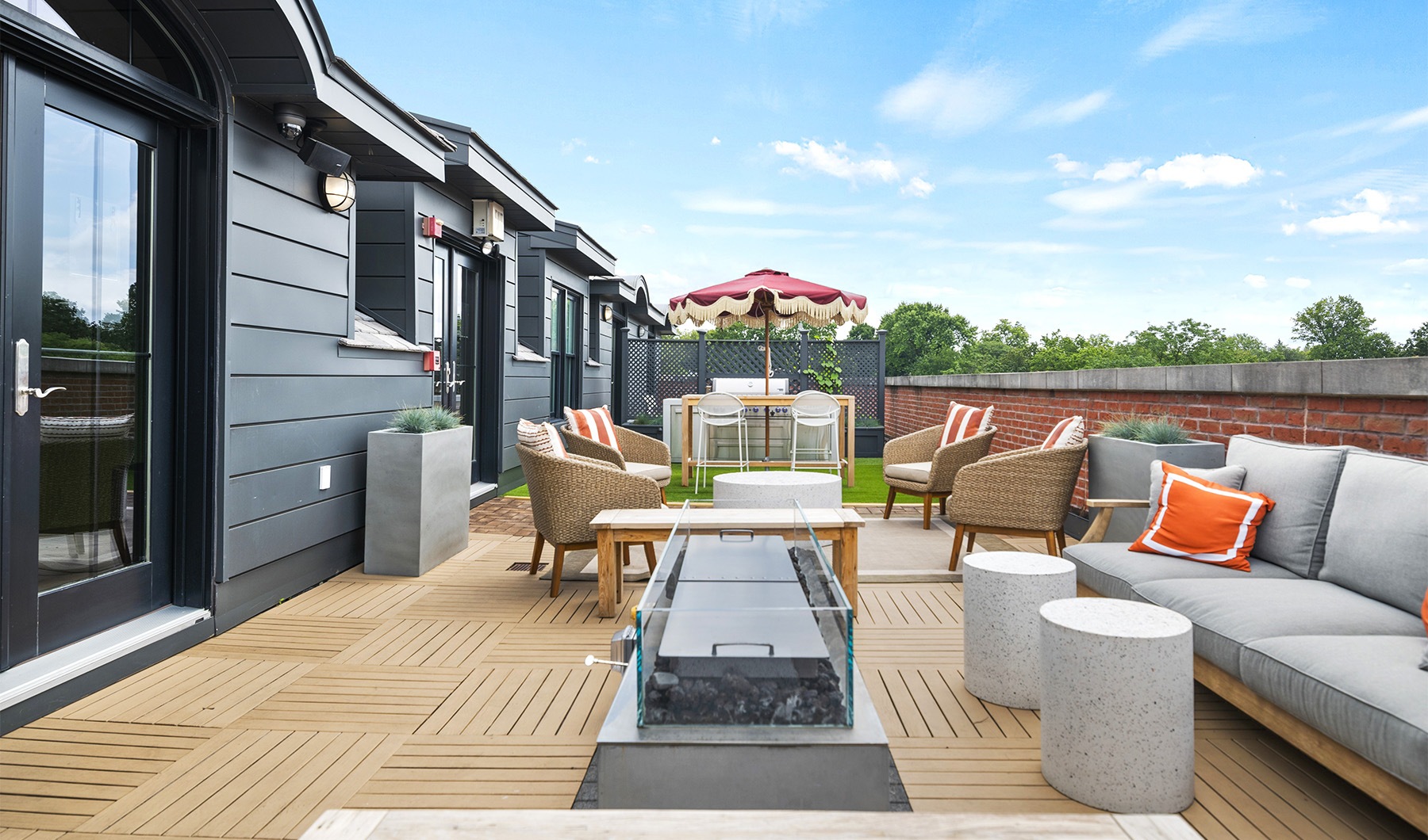 A boutique apartment community a patio with couches and chairs